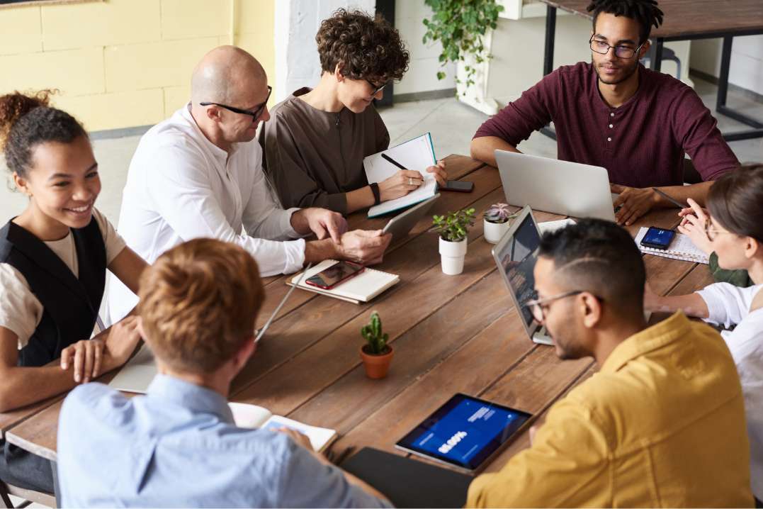 Diverse-group-of-accounting-professionals-in-a-meeting-about-outsourcing-accounts-receivable